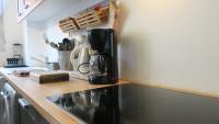 a kitchen with a counter top with a coffee maker at Aligre in Paris