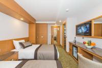 Postel nebo postele na pokoji v ubytování Bisetun Hotel