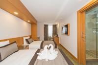 Postel nebo postele na pokoji v ubytování Bisetun Hotel