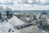 a gondola ride over a river in a city at citizenM Southwark Bankside in London