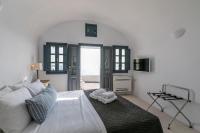 Postel nebo postele na pokoji v ubytování Nostos Apartments