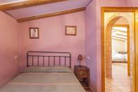 A bed or beds in a room at Villa Loaisa