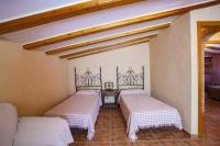 A bed or beds in a room at Villa Loaisa