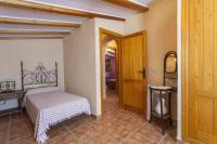 A bed or beds in a room at Villa Loaisa