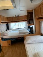 Posteľ alebo postele v izbe v ubytovaní PS-Caravaning auf Union Lido - Wohnwagenvermietung