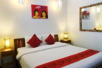 Ein Bett oder Betten in einem Zimmer der Unterkunft Sok San Beach Resort