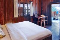 Ein Bett oder Betten in einem Zimmer der Unterkunft Sok San Beach Resort