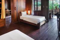 Ein Bett oder Betten in einem Zimmer der Unterkunft Sok San Beach Resort
