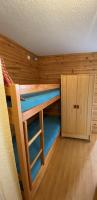 a room with a bunk bed and a cabinet at Boost Your Immo Les Airelles Risoul 375 in Risoul