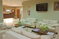 a living room with couches and a flat screen tv at Holiday Inn Express Campo de Gibraltar-Barrios, an IHG Hotel in Los Barrios