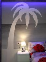 A bed or beds in a room at Ocean View Elegant Magic Apartment