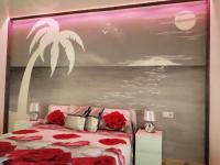 A bed or beds in a room at Ocean View Elegant Magic Apartment