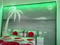 A bed or beds in a room at Ocean View Elegant Magic Apartment