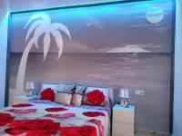 A bed or beds in a room at Ocean View Elegant Magic Apartment