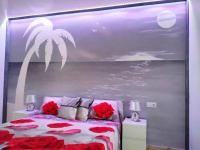 A bed or beds in a room at Ocean View Elegant Magic Apartment