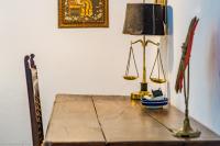 a desk with a lamp and a scale on it at Cortijo El Indiviso in Vejer de la Frontera