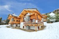 a log cabin in the snow with a balcony at Chalet ALPACA Peisey-Vallandry - Domaine Paradiski in Peisey-Nancroix