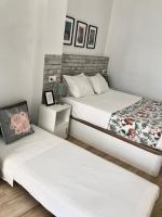 Postel nebo postele na pokoji v ubytování Apartamentos Élite - Art Collection - Frida