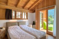 A bed or beds in a room at VILLAGGIO VAL MOLINI
