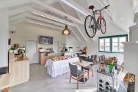 a dining room with a bike hanging from the ceiling at Pension Kral in Rust