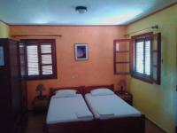 Postel nebo postele na pokoji v ubytování Sunrise Apartments