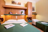 Łóżko lub łóżka w pokoju w obiekcie Hotel Trastevere