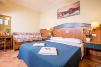Łóżko lub łóżka w pokoju w obiekcie Hotel Trastevere