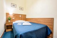 Łóżko lub łóżka w pokoju w obiekcie Hotel Trastevere