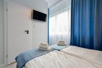 Posteľ alebo postele v izbe v ubytovaní Candy Apartments Warszawa