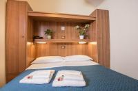 Łóżko lub łóżka w pokoju w obiekcie Hotel Trastevere