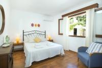A bed or beds in a room at Owl Booking Villa Vallori - 5 Min Walk to the Beach