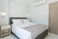 Posteľ alebo postele v izbe v ubytovaní KIPOI APARTMENTS