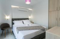 Posteľ alebo postele v izbe v ubytovaní KIPOI APARTMENTS
