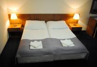 Posteľ alebo postele v izbe v ubytovaní Hotel Olimpijski