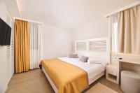 Ein Bett oder Betten in einem Zimmer der Unterkunft Villas Bellevue Plava Laguna