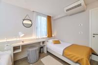 Ein Bett oder Betten in einem Zimmer der Unterkunft Villas Bellevue Plava Laguna