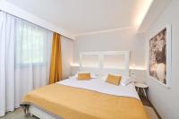 Ein Bett oder Betten in einem Zimmer der Unterkunft Villas Bellevue Plava Laguna