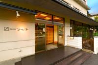 an entrance to a building with glass doors at Wafu-no-Yado MASUYA in Yamanouchi