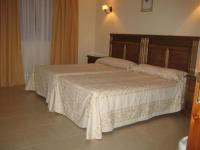 Posteľ alebo postele v izbe v ubytovaní Hotel Las Fuentes