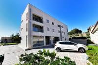 a white car parked in front of a building at Romana Serena Sunset in Vrsar