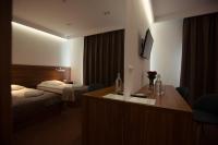 Posteľ alebo postele v izbe v ubytovaní Hotel Rubin