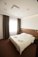 Posteľ alebo postele v izbe v ubytovaní Hotel Rubin