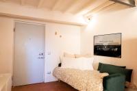 Posteľ alebo postele v izbe v ubytovaní ORANGE Tuscany Flat