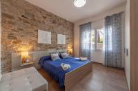 Łóżko lub łóżka w pokoju w obiekcie Prima dell'Elba Family Apartments