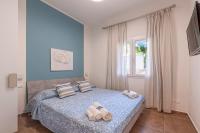 Łóżko lub łóżka w pokoju w obiekcie Prima dell'Elba Family Apartments
