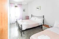 Posteľ alebo postele v izbe v ubytovaní HostMe Gardenhouse Vaticano