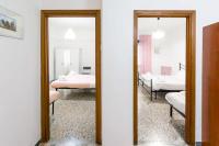 Posteľ alebo postele v izbe v ubytovaní HostMe Gardenhouse Vaticano