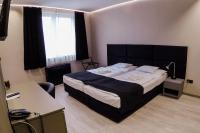 Posteľ alebo postele v izbe v ubytovaní Sóház Panzió és Apartmanház