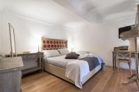 A bed or beds in a room at Palazzo Mandurino luxury relais