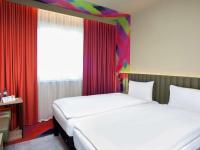 Posteľ alebo postele v izbe v ubytovaní ibis Styles Parndorf Neusiedler See